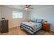 Comfortable bedroom featuring natural lighting, brick accent wall, and ample closet space at 10713 E Oasis Dr, Mesa, AZ 85208
