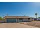 Inviting single-story home featuring a classic facade and well-kept yard, perfect for comfortable living at 10713 E Oasis Dr, Mesa, AZ 85208