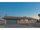 Charming single-story home with a well-maintained front yard and a two-car garage at 10713 E Oasis Dr, Mesa, AZ 85208