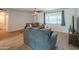 Cozy living room with comfortable seating and a large window with natural light at 10713 E Oasis Dr, Mesa, AZ 85208