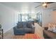 Open concept living room with stylish furniture and a seamless flow to the kitchen at 10713 E Oasis Dr, Mesa, AZ 85208