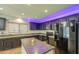 Well-equipped kitchen with black appliances, island, and ample counter space at 10817 W Pierson St, Phoenix, AZ 85037