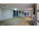 Open living room featuring tiled floors, custom fireplace, and staircase access to the upper level at 10817 W Pierson St, Phoenix, AZ 85037