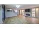Stylish living room with tiled floors, custom fireplace, and decorative lighting at 10817 W Pierson St, Phoenix, AZ 85037