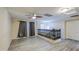 Spacious loft area with wood-look flooring and natural light, perfect for relaxing at 10817 W Pierson St, Phoenix, AZ 85037
