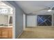View of the main bedroom featuring carpet flooring, ceiling fan and entrances to the bathroom and closet at 10817 W Pierson St, Phoenix, AZ 85037