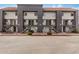 View of apartment building with multiple units, stairs leading to entry doors, and a red tile roof at 1215 E Lemon St # 222, Tempe, AZ 85281