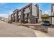 Exterior view of a multi-unit apartment building featuring gray accents and access stairs at 1215 E Lemon St # 222, Tempe, AZ 85281