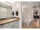 Well-lit bathroom with a granite countertop vanity and easy access to the hallway and bedroom at 1215 E Lemon St # 222, Tempe, AZ 85281