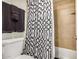 Cozy bathroom featuring a decorative shower curtain and essential towel storage at 1215 E Lemon St # 222, Tempe, AZ 85281