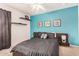 Stylish bedroom with floating shelves, statement wall, and modern decor at 1215 E Lemon St # 222, Tempe, AZ 85281