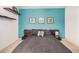 Stylish bedroom with floating shelves, modern decor, and neutral carpet at 1215 E Lemon St # 222, Tempe, AZ 85281