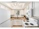 Open kitchen with granite counters, white cabinets, and newer appliances at 1215 E Lemon St # 222, Tempe, AZ 85281