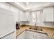 Bright kitchen features granite countertops, double sink, and modern appliances at 1215 E Lemon St # 222, Tempe, AZ 85281