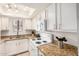 Bright kitchen featuring granite counters, white appliances, and ample cabinet space at 1215 E Lemon St # 222, Tempe, AZ 85281
