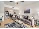 Open-concept living room featuring tile flooring, a comfortable sofa, and access to the dining area at 1215 E Lemon St # 222, Tempe, AZ 85281