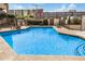 Community pool with crystal-clear water, lounging chairs, and secure fencing, perfect for relaxation and recreation at 1215 E Lemon St # 222, Tempe, AZ 85281