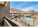 Balcony view overlooking a refreshing community pool and well-maintained landscape at 1215 E Lemon St # 222, Tempe, AZ 85281