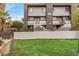 Community signage on a well-maintained green lawn with a view of the unit building showcasing its architectural design at 1215 E Lemon St # 222, Tempe, AZ 85281
