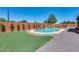 Backyard with a pool, patio, and green space, perfect for relaxing at 1266 S Harrington St, Gilbert, AZ 85233