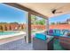 Well manicured backyard with pool, patio, outdoor seating and privacy wall at 1266 S Harrington St, Gilbert, AZ 85233