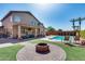 Spacious backyard offering a sparkling pool, fire pit, and outdoor seating at 1266 S Harrington St, Gilbert, AZ 85233