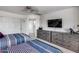 White bedroom boasts carpet floors, ceiling fan, two beds, and dresser storage at 1266 S Harrington St, Gilbert, AZ 85233