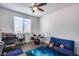Well-lit bedroom with drum set, gaming area and natural light at 1266 S Harrington St, Gilbert, AZ 85233