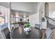 Cozy dining area with a round table, upholstered chairs, and an open layout at 1266 S Harrington St, Gilbert, AZ 85233
