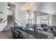 Dining room featuring elegant light fixture and stairway leading to the front door at 1266 S Harrington St, Gilbert, AZ 85233