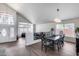 Elegant dining room featuring a modern chandelier and large windows at 1266 S Harrington St, Gilbert, AZ 85233