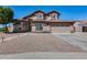 Beautiful two-story home with a tile roof, desert landscaping, and attached two-car garage at 1266 S Harrington St, Gilbert, AZ 85233
