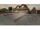 Charming two-story home with a tile roof, well-manicured landscaping, and a spacious two car garage at 1266 S Harrington St, Gilbert, AZ 85233