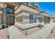 Charming home exterior featuring stone accents, desert landscaping and an arched entryway at 1266 S Harrington St, Gilbert, AZ 85233