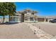 Two-story home featuring a desert landscape, tile roof, and paved walkway at 1266 S Harrington St, Gilbert, AZ 85233