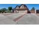 Well-maintained home with desert landscaping, paved driveway, and attached two-car garage at 1266 S Harrington St, Gilbert, AZ 85233