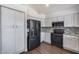 Spacious kitchen featuring white cabinetry and modern black appliances at 1266 S Harrington St, Gilbert, AZ 85233