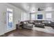 Bright living room showcasing large sectional sofa and outdoor access at 1266 S Harrington St, Gilbert, AZ 85233