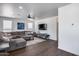 Open-concept living room with hardwood floors and ample seating area at 1266 S Harrington St, Gilbert, AZ 85233