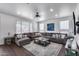 Bright living room showcasing large sectional sofa and ample windows at 1266 S Harrington St, Gilbert, AZ 85233