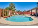 Backyard pool with lush landscaping, patio furniture, and brick privacy wall at 1266 S Harrington St, Gilbert, AZ 85233