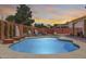 Beautiful backyard featuring a refreshing pool with decorative planters and a seating area for outdoor enjoyment at 1266 S Harrington St, Gilbert, AZ 85233