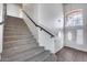 Stairway with carpeted steps, leading to a bright, white-walled entry area at 1266 S Harrington St, Gilbert, AZ 85233