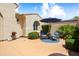 Cozy back patio area with pavers, seating, and a shade umbrella perfect for outdoor relaxation at 12738 W Nogales Dr, Sun City West, AZ 85375