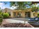 Expansive backyard features a patio with seating, lush trees, and serene outdoor enjoyment at 12738 W Nogales Dr, Sun City West, AZ 85375