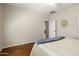 Cozy bedroom featuring hardwood floors and neutral walls, creating a serene and inviting atmosphere at 12738 W Nogales Dr, Sun City West, AZ 85375