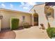 Charming courtyard with beautiful planters, manicured hedges, and stylish architecture at 12738 W Nogales Dr, Sun City West, AZ 85375