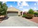 Charming single-story home with beautiful desert landscaping and a well-manicured lawn at 12738 W Nogales Dr, Sun City West, AZ 85375