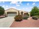 Inviting single-story home with desert landscaping, a two car garage, and arched entryway at 12738 W Nogales Dr, Sun City West, AZ 85375