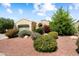 Charming single-story home with beautiful desert landscaping and a well-manicured lawn at 12738 W Nogales Dr, Sun City West, AZ 85375
